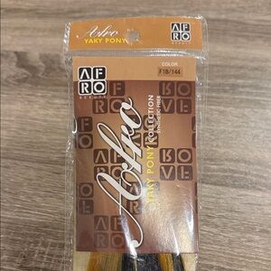 Afro Yaky Pony synthetic hair from the Afro Beauty Collection, in color F1B/144